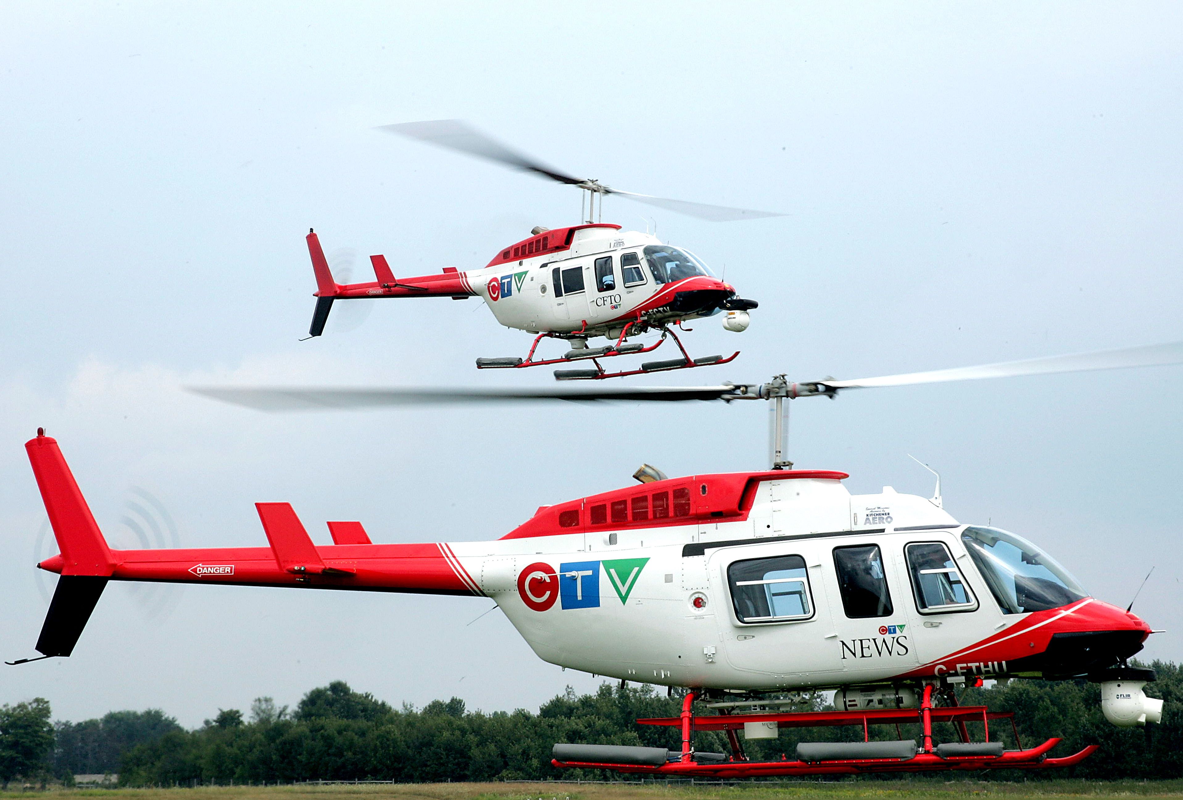 Two Bell 206 helicopters in CTV news livery