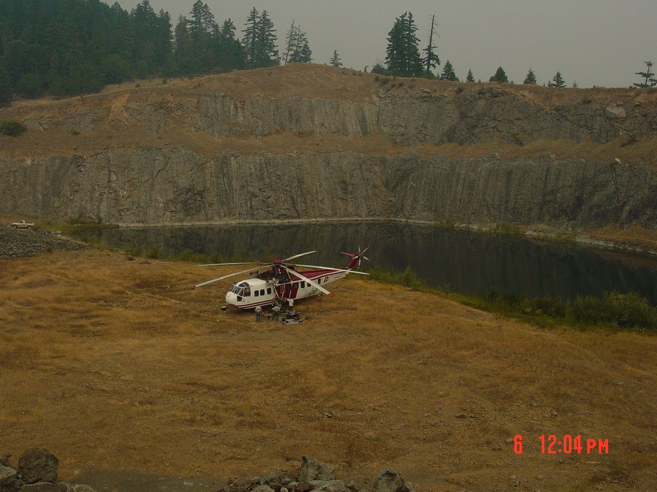 Helicopter landed on the floor of an open pit