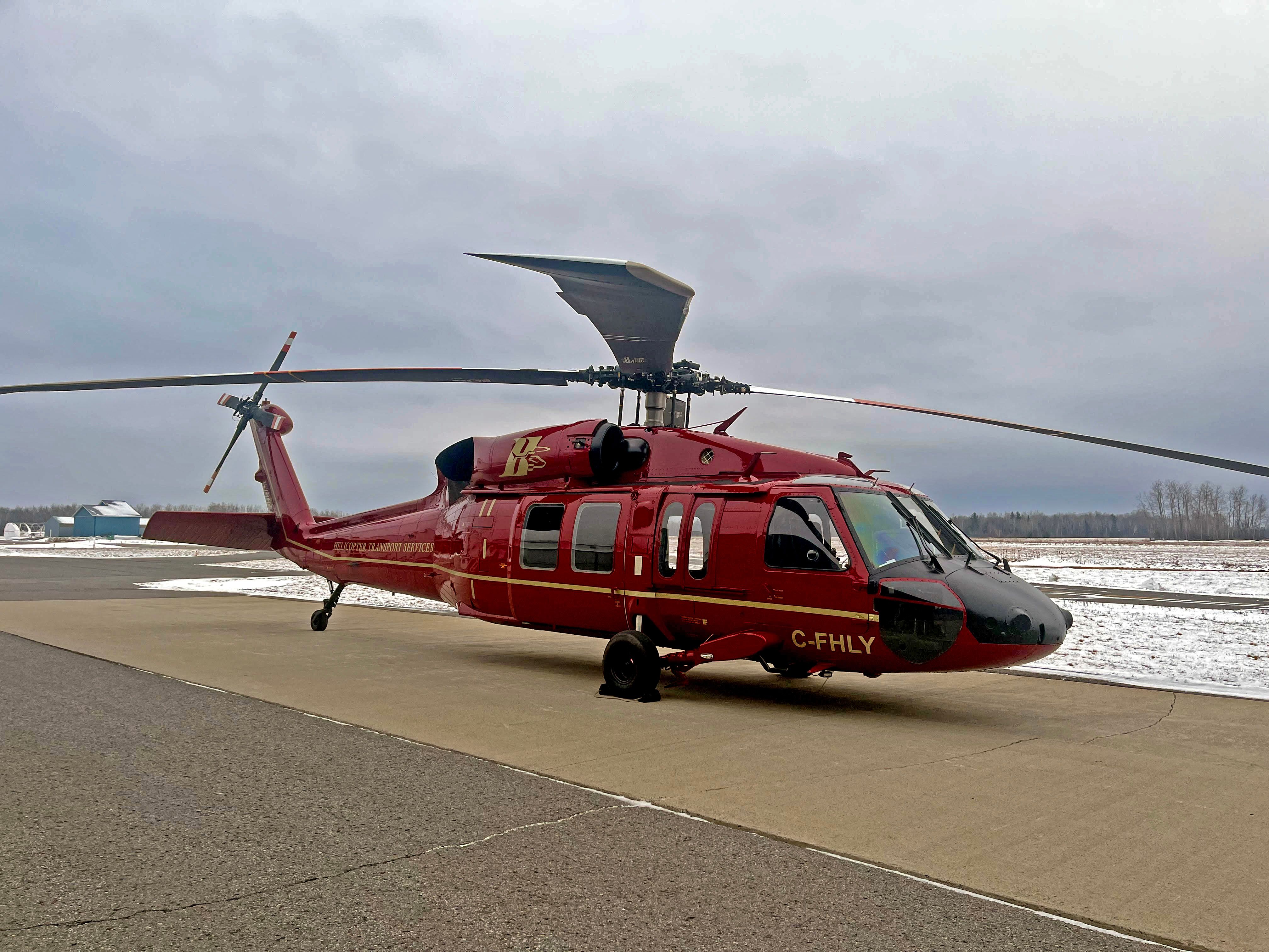 HTS Black Hawk parked on a ramp in winter