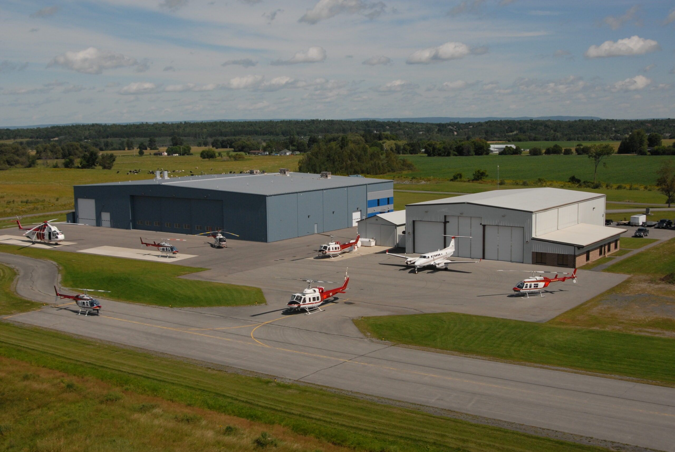 Aerial view of the HTS head office base at Carp, with helicopters and a turboprop on the ramp